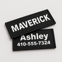Two black patches with white text on a light gray background
