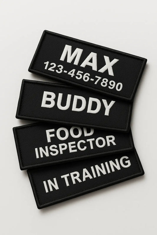 Four black rectangular patches with white text on a light gray background